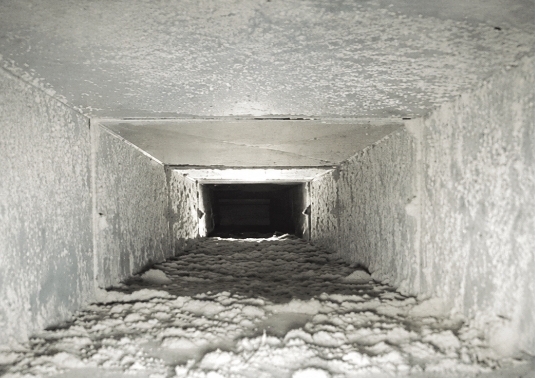 Duct before cleaning showing dust and dirt